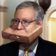 Image for article titled Panicking Mitch McConnell Shoves Entire Senate Healthcare Bill Into Mouth As Democrat Walks Past